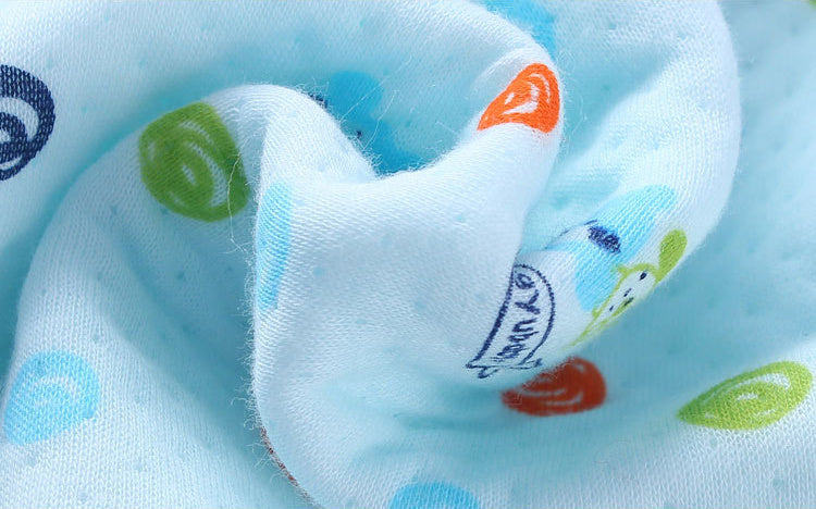 Close-up of soft blue adorable bear baby quilt with colorful bear and swirl prints