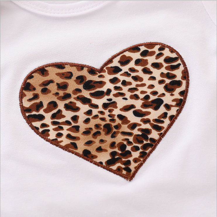 Leopard print heart patch on white fabric from baby clothing gift set leopard
