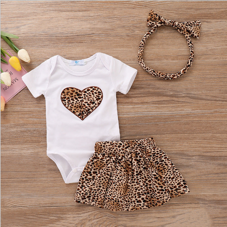 Baby clothing gift set leopard with white onesie featuring leopard heart, matching skirt and headband