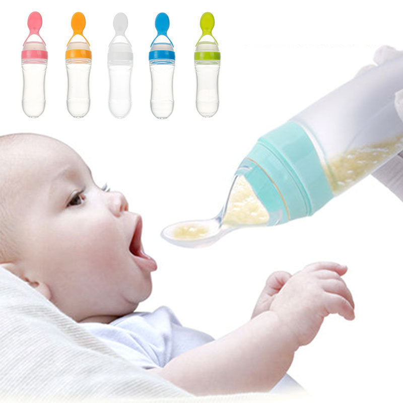 Baby food supplement feeder with soft silicone spoon feeding puree to an infant, available in multiple colors