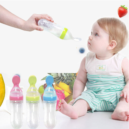 Baby food supplement feeder bottles in pink green and blue with baby and feeding spoon
