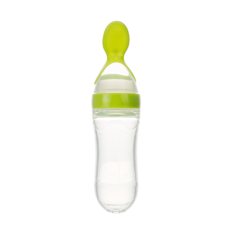 Clear baby food supplement feeder with green silicone spoon and cap for easy feeding
