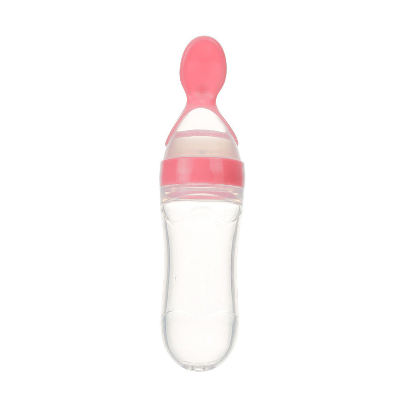 Clear baby food supplement feeder with pink spoon cap for easy feeding and soft silicone tip