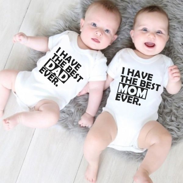 Two babies wearing matching white baby romper for summer with I have the best mom and dad ever text