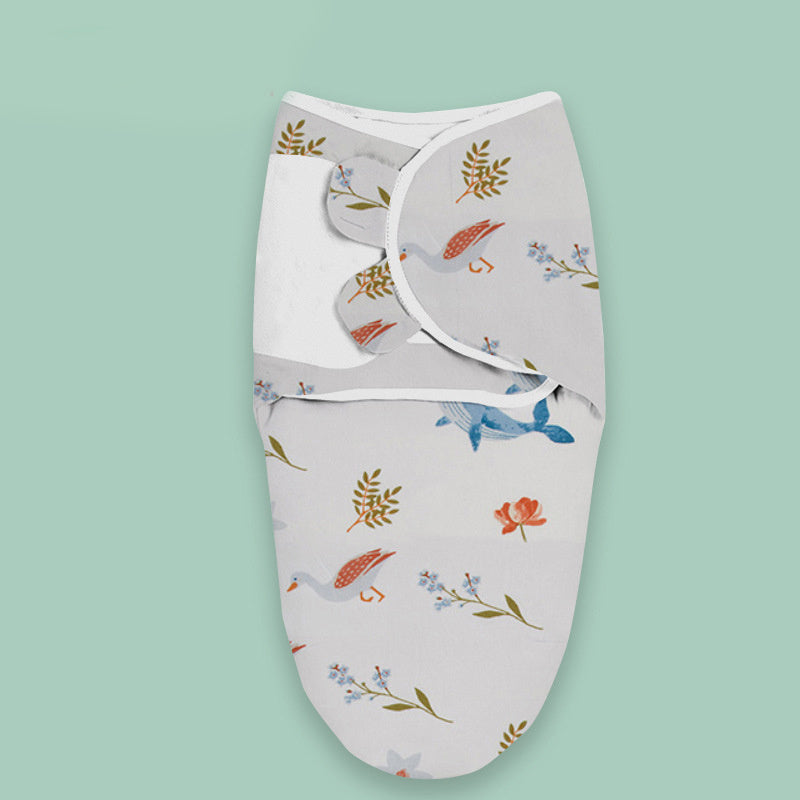 Cloud print newborn swaddle blanket with bird and floral pattern wrapped on light green background