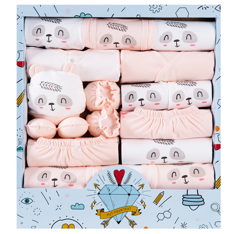 Cotton newborn gift set with soft peach and white baby clothes featuring cute animal faces in a gift box