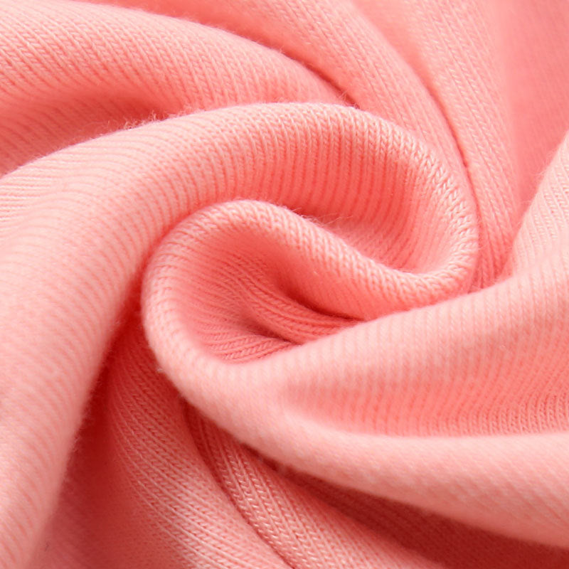 Close-up of soft pink fabric texture showing cotton tops for toddlers material details