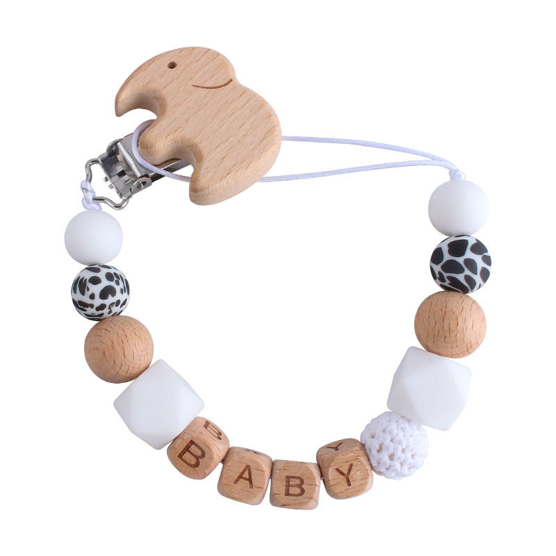 Cute baby pacifier chain with wooden duck clip and beads spelling BABY in natural and white colors