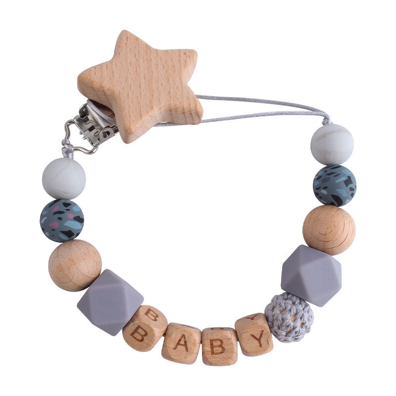 Cute baby pacifier chain with wooden star clip and colorful beads including letter blocks spelling BABY