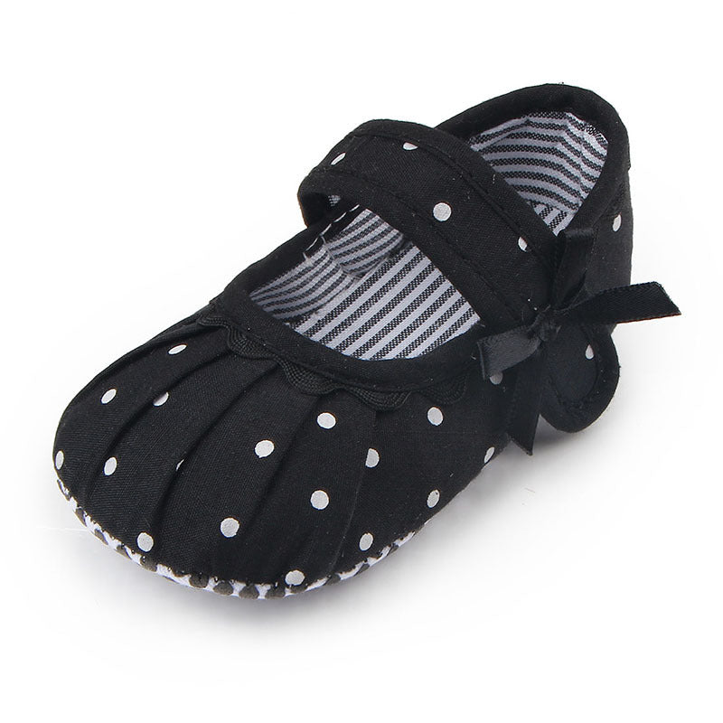 Black and white polka dot cute princess baby shoes with strap and bow detail