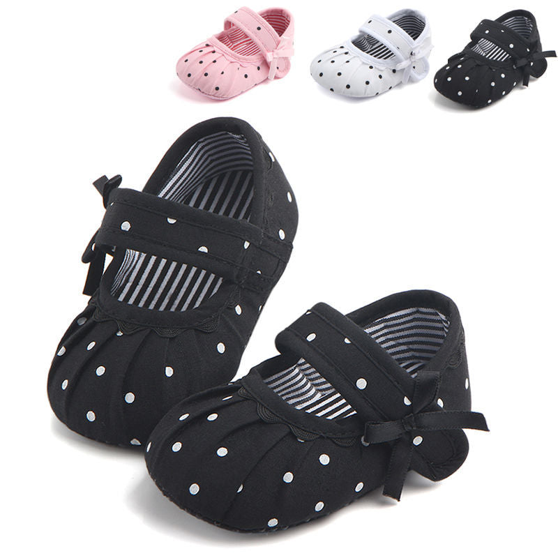 Cute princess baby shoes in black with white polka dots and bow detail, also available in pink and white