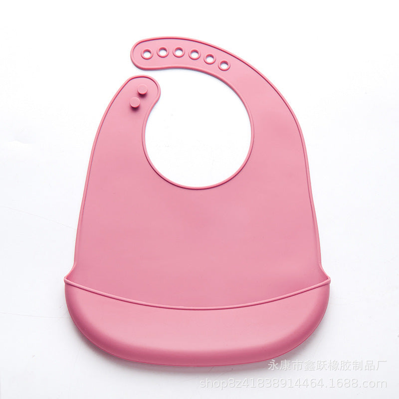 Pink easy clean baby eating bib with adjustable neck buttons and food catcher pocket