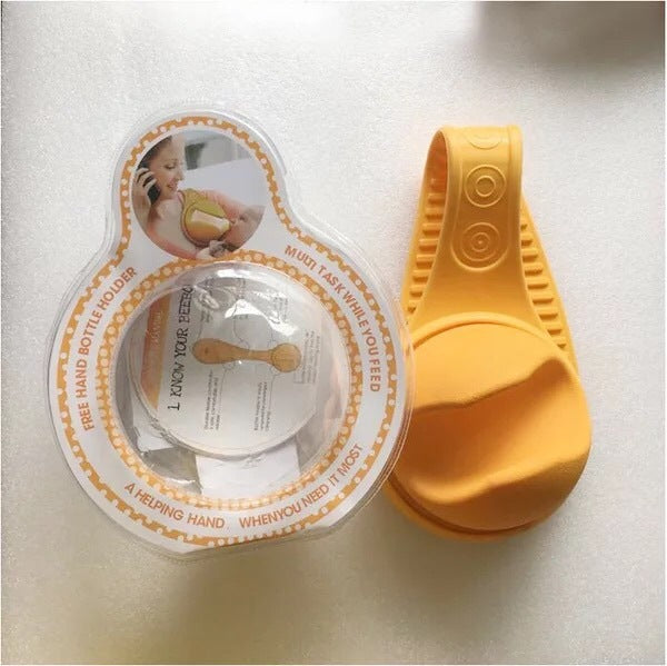 Yellow hands free baby bottle holder with adjustable grip and flexible silicone design for multitasking parents