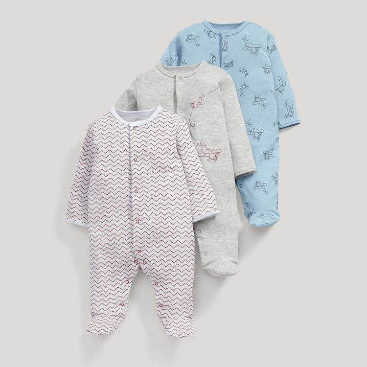 Set of three long sleeve baby onesie in blue, gray, and white with printed patterns