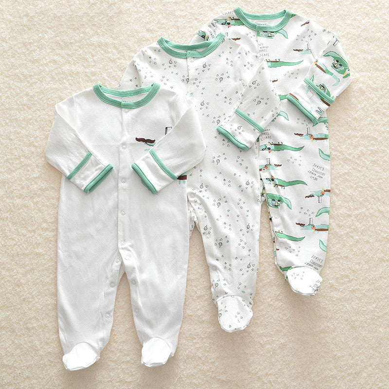 Set of three long sleeve baby onesie with green trim in white and printed designs