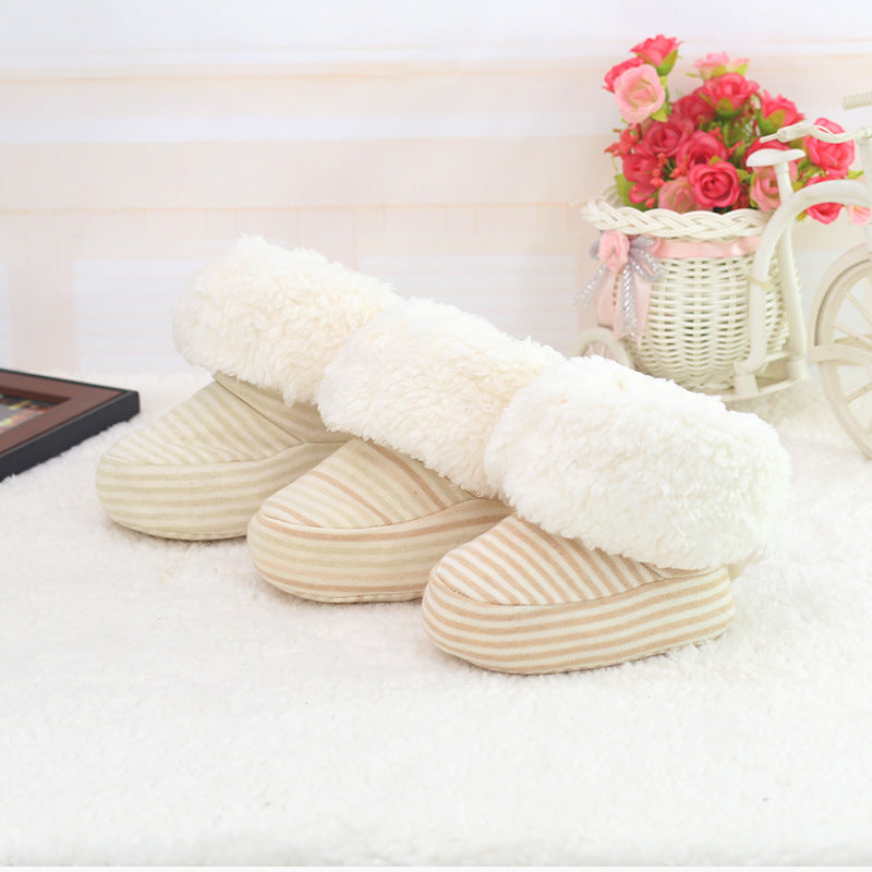 Newborn cozy print baby shoes featuring soft striped fabric and plush white cuff for warmth and comfort