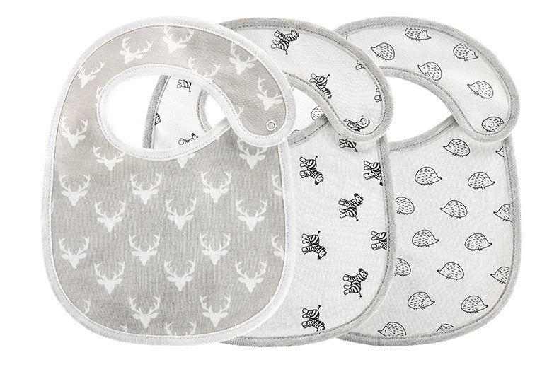 Set of soft cotton baby bibs set with deer, zebra, and hedgehog prints in neutral colors