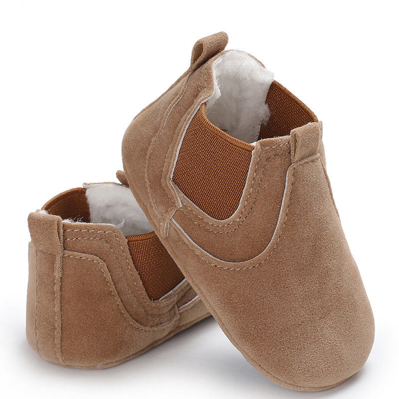 Brown soft sole infant shoes with elastic side panels and plush lining for comfort