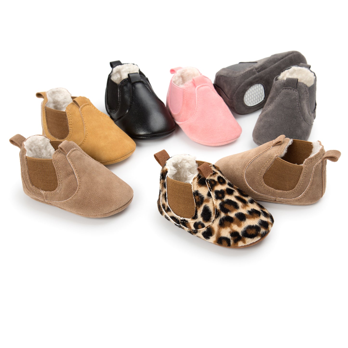 Assorted soft sole infant shoes in various colors and patterns with plush lining for comfort