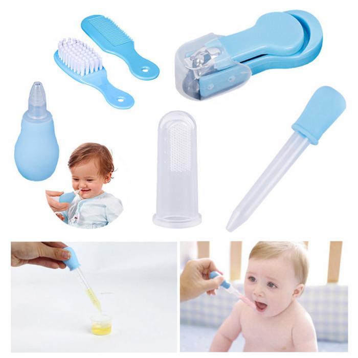 Complete baby grooming set with blue comb, brush, nail clipper, nasal aspirator, medicine dropper, and finger toothbrush