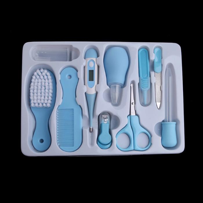 Complete baby grooming set with blue brush, comb, thermometer, nail clippers, scissors, and other care tools