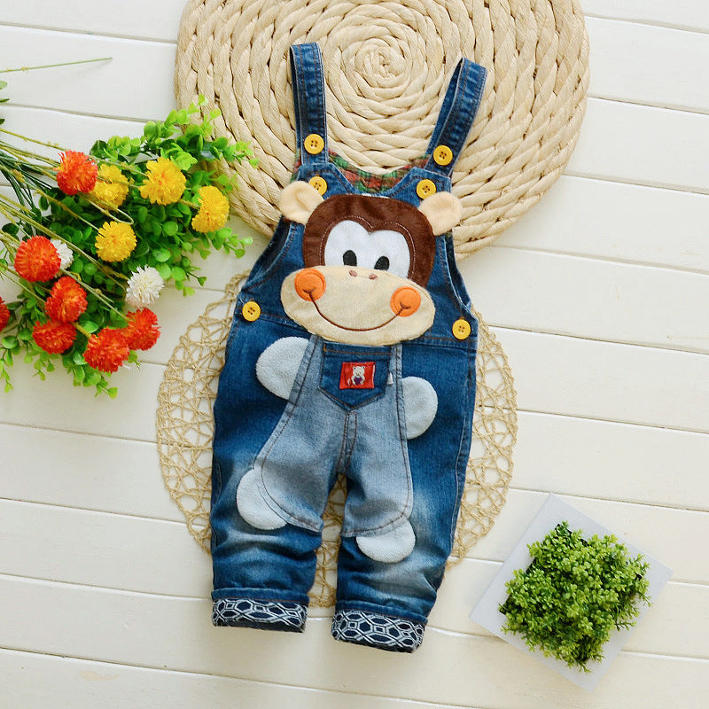 Cute denim bib jeans for toddlers with a playful monkey face design and yellow button straps