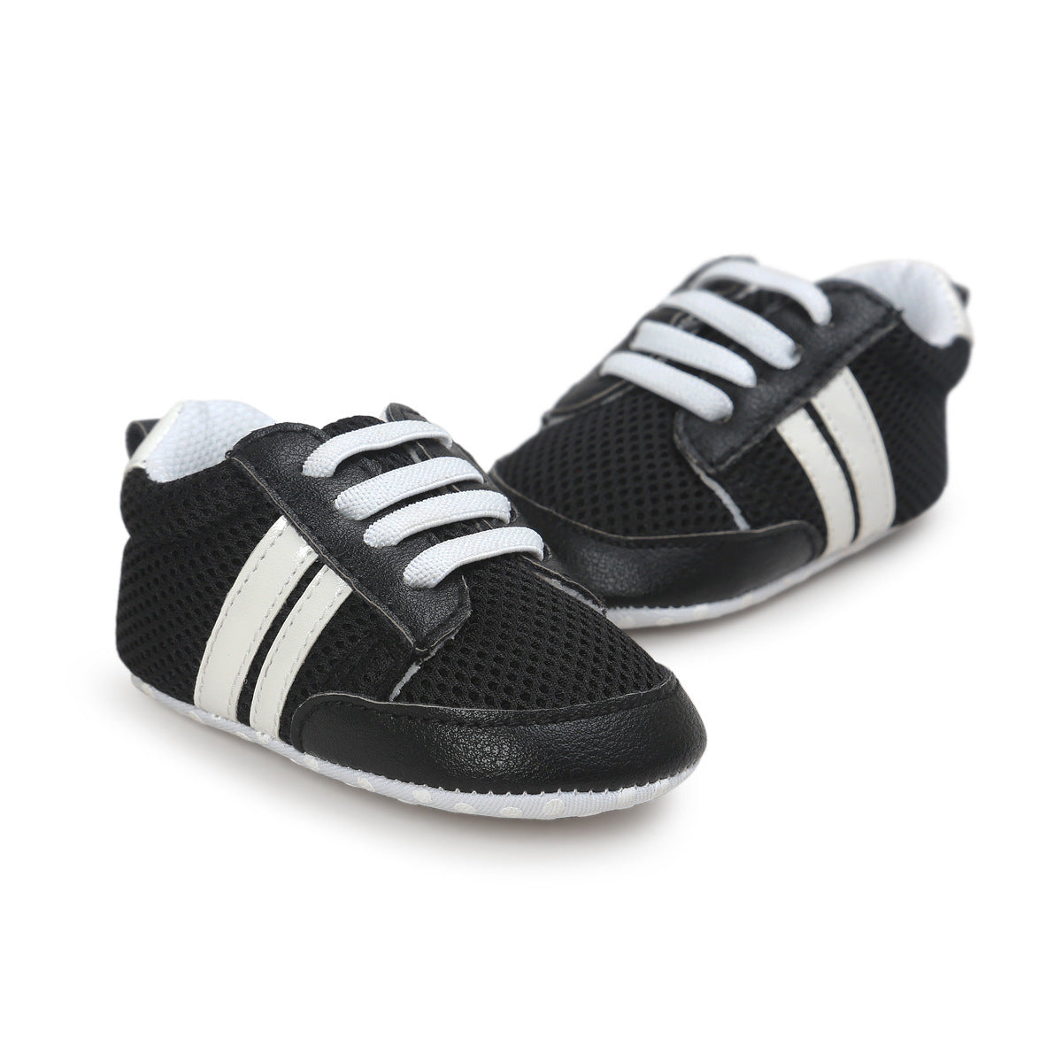 Black and white infant moccasin shoes with laces and breathable mesh fabric for toddlers