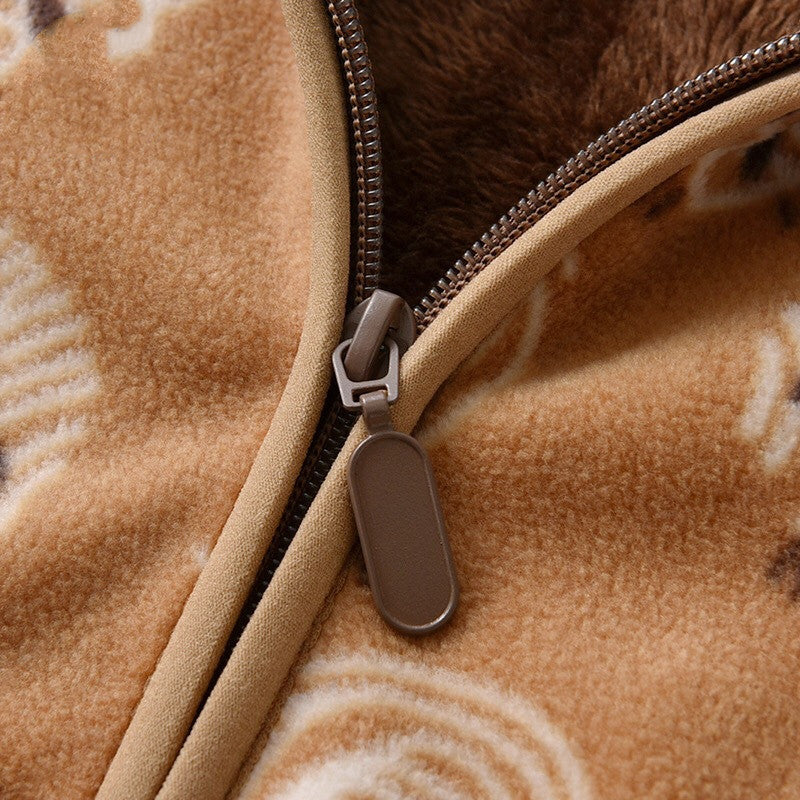 Close-up of zipper on warm baby coat for winter made of soft brown fleece fabric