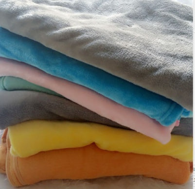 Stack of soft colorful baby comfort sleep pillow covers in pastel and bold shades for infants