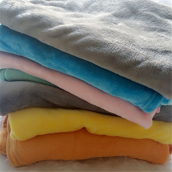 Stack of soft colorful baby comfort sleep pillow covers in neutral and pastel shades