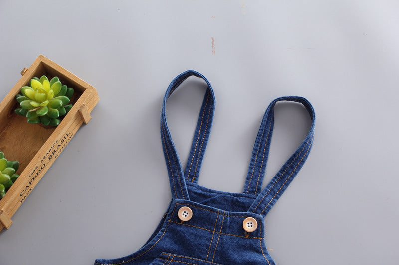 Blue denim overalls for baby boys with adjustable straps and wooden buttons