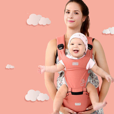 Smiling mother carrying happy baby in pink best baby carrier for moms on peach background