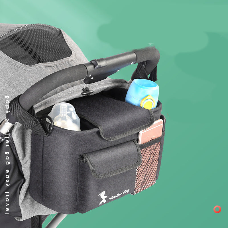 Black baby essentials organizer for stroller with multiple compartments holding bottles and phone