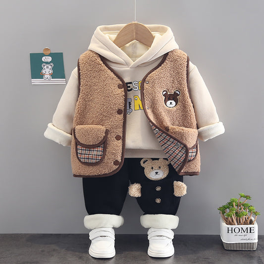 Warm toddler clothes set featuring a beige hoodie, brown fuzzy vest with bear patch, black pants with bear details, and white shoes