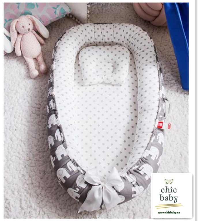 Portable baby travel crib with soft star pattern and elephant print for comfortable infant sleep