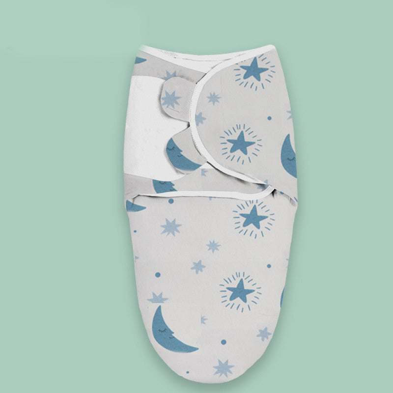 Soft cloud print newborn swaddle blanket with blue stars and moon pattern on white fabric