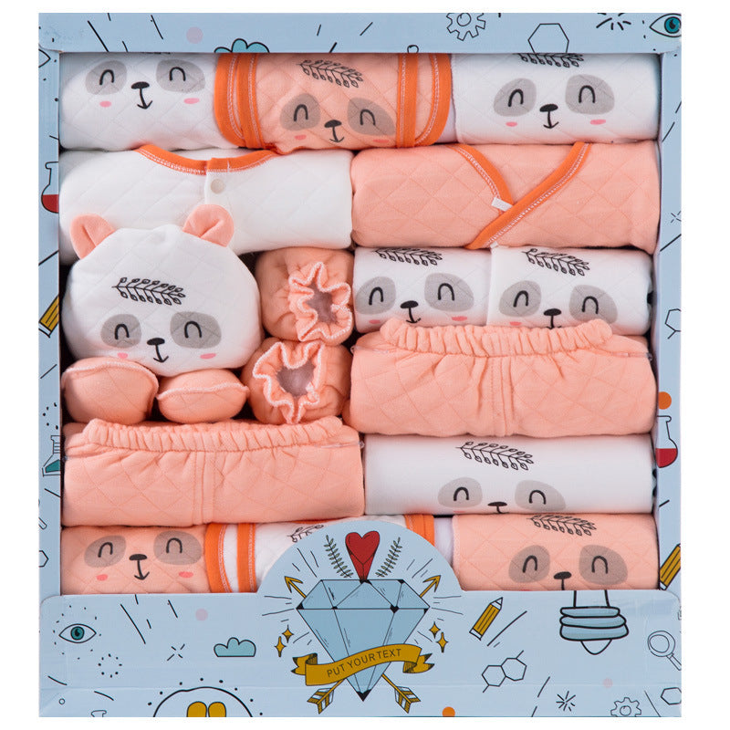 Cotton newborn gift set featuring soft peach and white baby clothes with bear faces in a decorative box