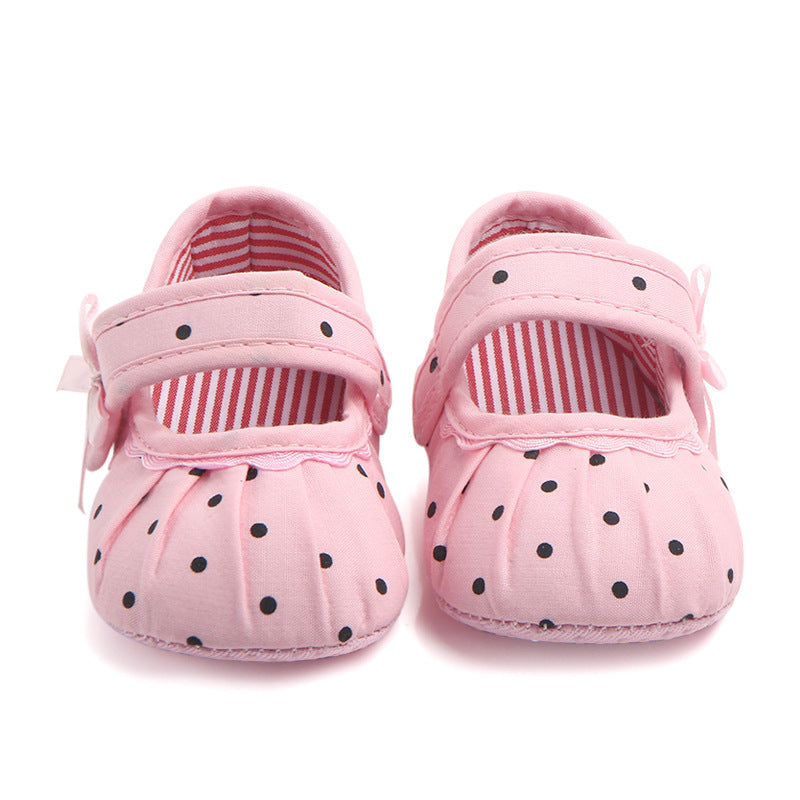 Pink cute princess baby shoes with black polka dots and striped inner lining for infants
