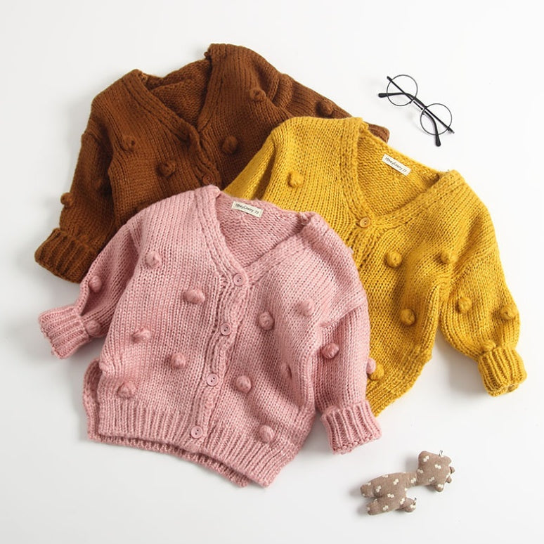 Cute toddler cardigan for girls in pink, mustard yellow, and brown with pom pom details