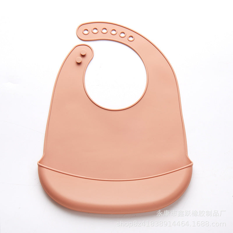 Peach color easy clean baby eating bib with adjustable button strap and food catcher pocket