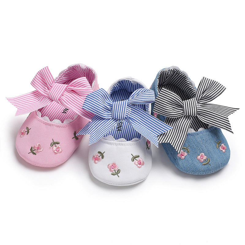 Pink white and blue floral crib shoes for girls with striped bows and embroidered flowers