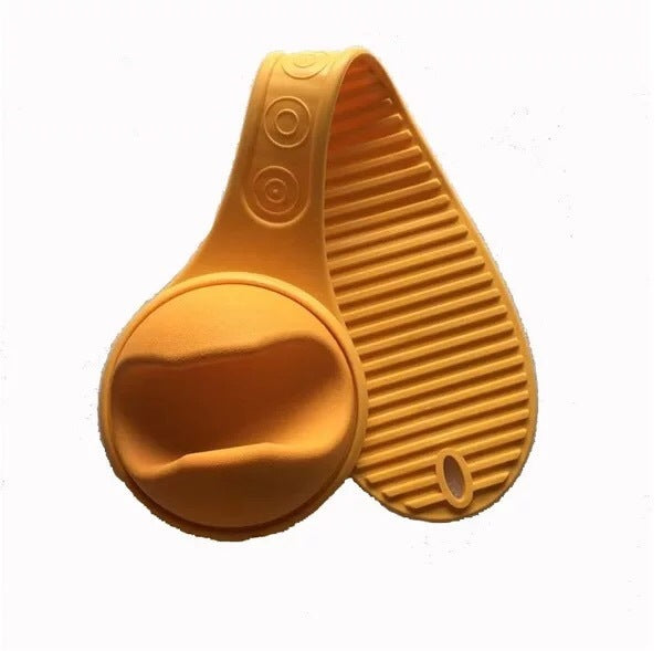 Orange hands free baby bottle holder made of flexible silicone for easy bottle support