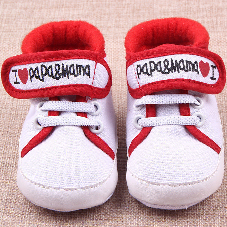 White baby shoes with red trim and hook-and-loop straps featuring I love mom and dad baby shoes design