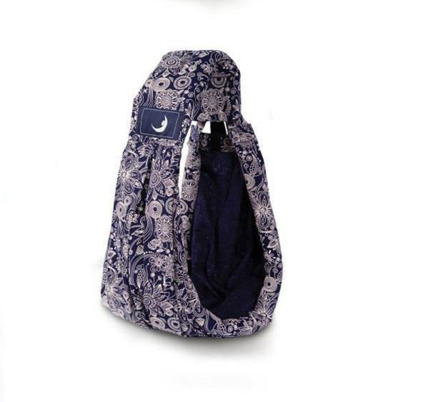 Blue patterned infant carrying strap baby carrier with soft padded interior for comfort