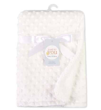 White soft newborn swaddle wrap with textured dot pattern and satin ribbon for baby care