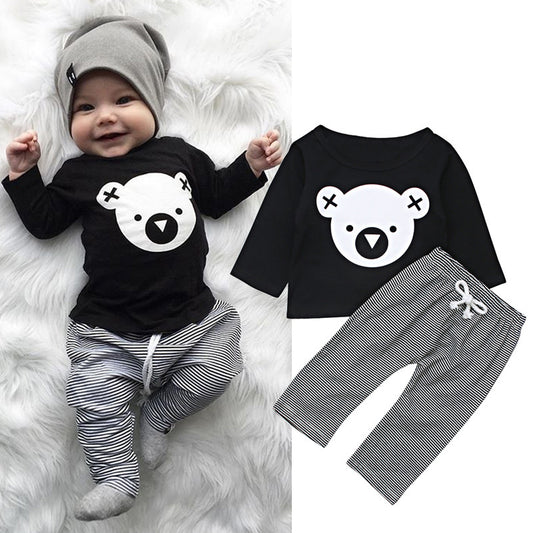 Black and white two piece kids loungewear set with bear face top and striped pants