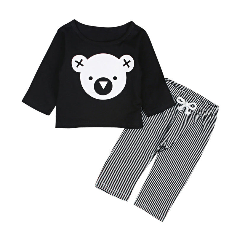 Two piece kids loungewear set with black long sleeve top featuring bear face and striped pants with white drawstring