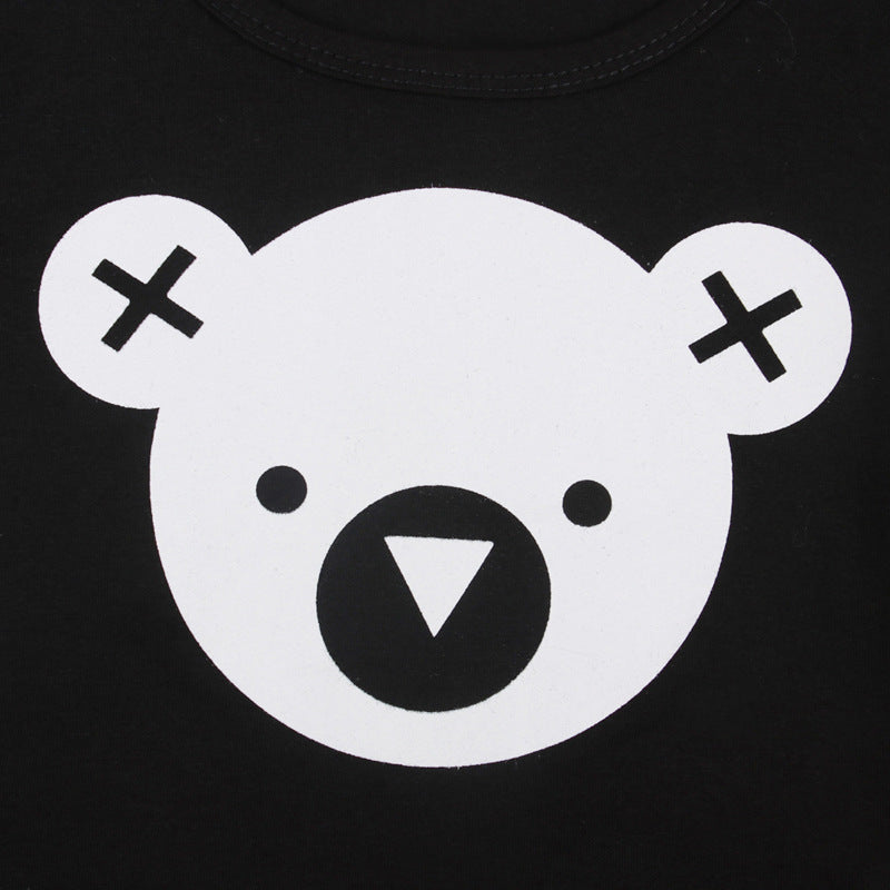 Close-up of black fabric with white bear face graphic on two piece kids loungewear set