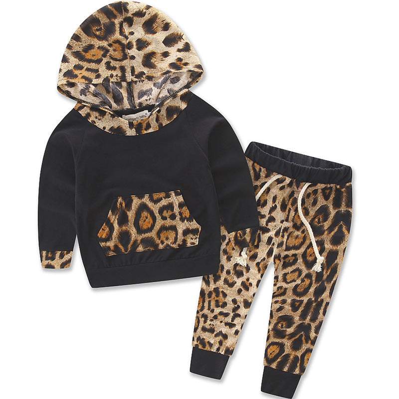 Kids leopard print outfit with black hoodie featuring leopard hood and pocket paired with matching leopard print pants