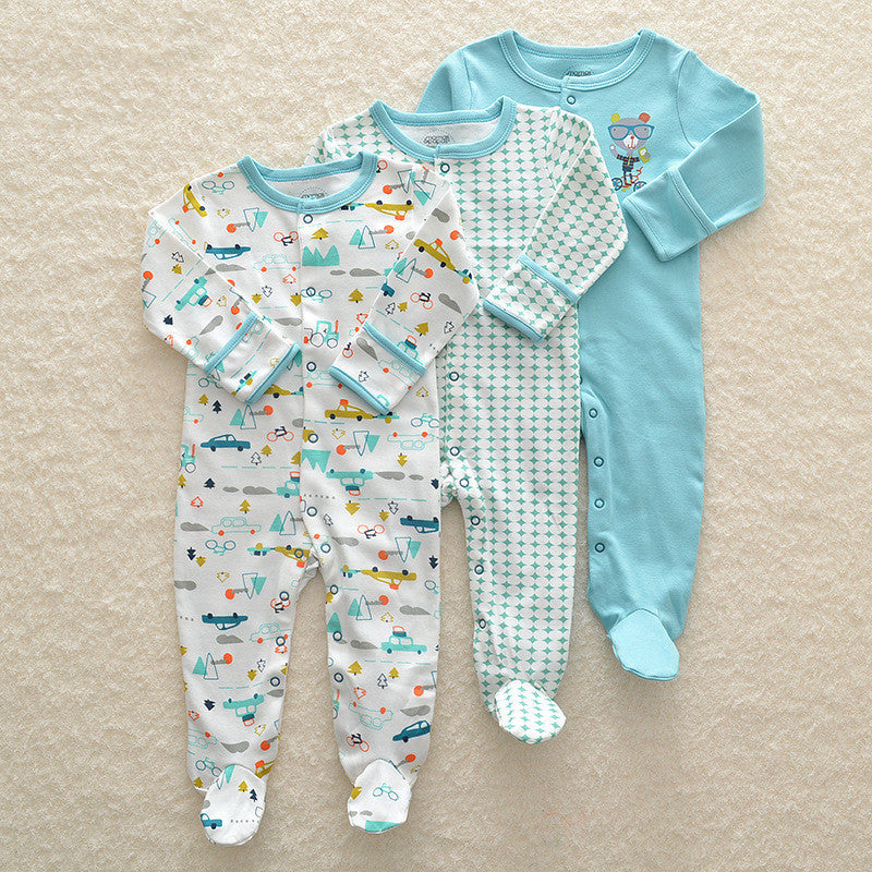 Set of three long sleeve baby onesie in blue and patterned designs with footed legs